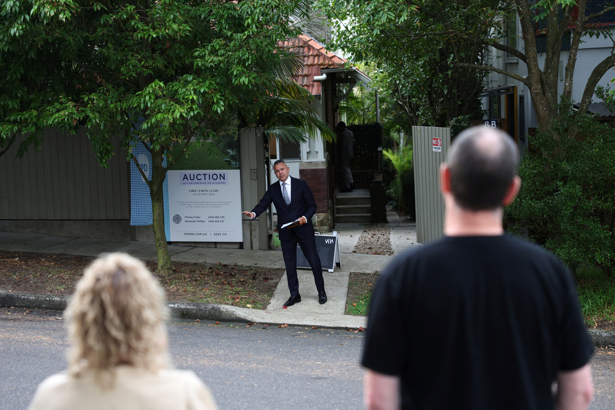 An auctioneer calls for bids during a property auction in Bondi, Sydney, Australia, June 13, 2026. REUTERS/Hollie Adams