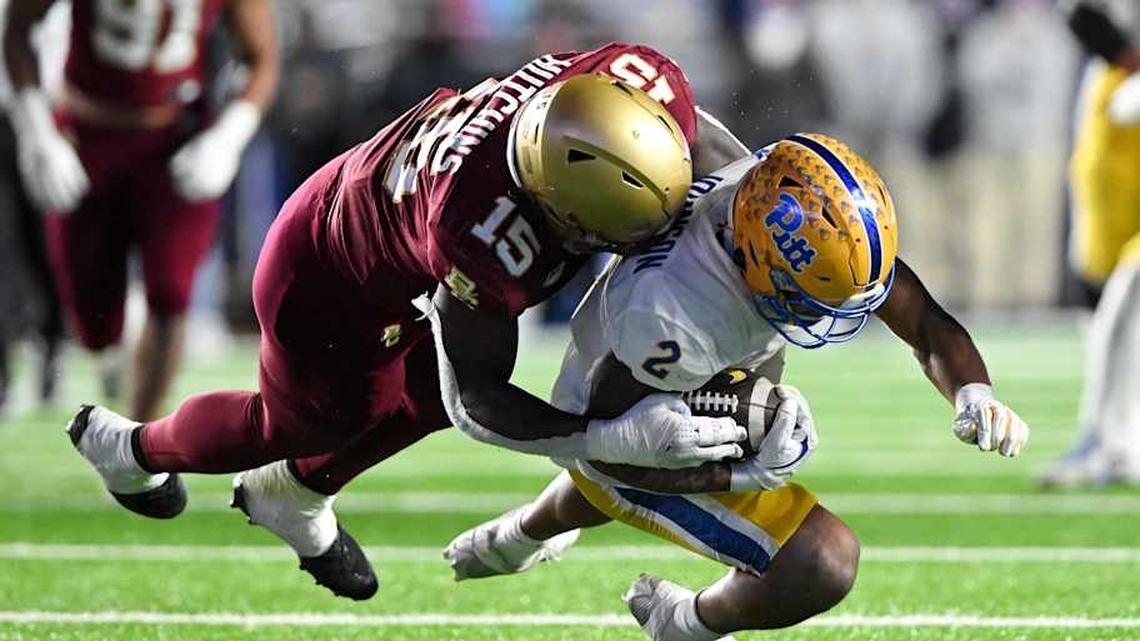  Nov 30, 2024; Chestnut Hill, Massachusetts, USA; Boston College Eagles defensive end Quintayvious Hutchins (15) tackles Pittsburgh Panthers wide receiver Kenny Johnson (2) during the second half at Alumni Stadium. Mandatory Credit: Brian Fluharty-Imagn Images | Brian Fluharty-Imagn Images 