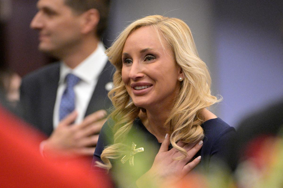 Florida Sen. Lauren Book, D-Plantation, stands for the Pledge of Allegiance during a legislative session, Tuesday, Jan. 11, 2022, in Tallahassee, Fla.