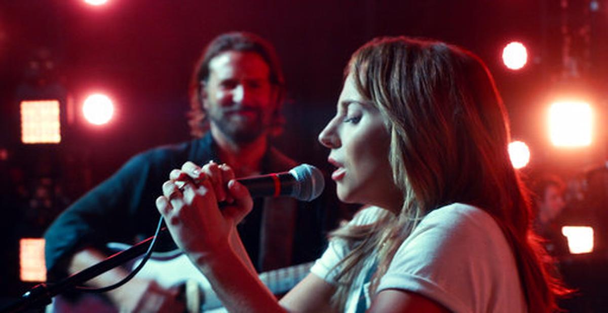 This image released by Warner Bros. shows Bradley Cooper, left, and Lady Gaga in a scene from the latest reboot of the film, “A Star is Born.” Surely literal goosebumps are a good sign that you’ve just seen a pretty stunning movie moment, specifically where Lady Gaga’s Ally takes a deep breath and walks out on stage to join Bradley Cooper’s Jackson Maine and sing her song in front of thousands of people.
