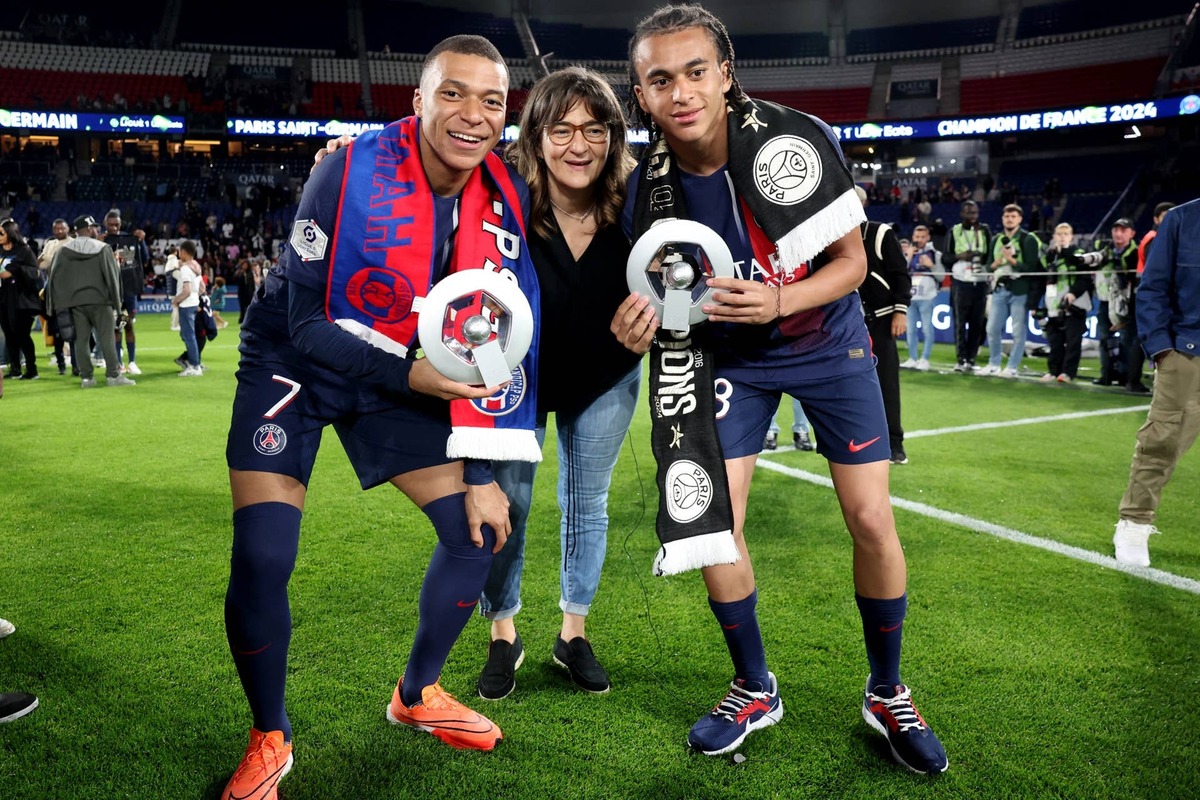  Paris Saint-Germain's French forward Kylian Mbappe Ethan Mbappe pose with their mother Fayza Lamari after a prize-giving ceremony marking the club's French Ligue 1 championship title. Photo by Franck FIFE / POOL / AFP via Getty Images