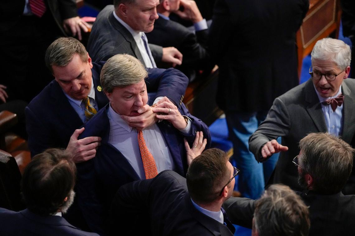 Rep. Richard Hudson, R-N.C., left, pulls Rep. Mike Rogers, R-Ala., back as they talk with Rep. Matt Gaetz, R-Fla., and other during the 14th round of voting for speaker as the House meets for the fourth day to try and elect a speaker and convene the 118th Congress in Washington, Friday, Jan. 6, 2023. At right is Rep. Patrick McHenry, R-N.C.