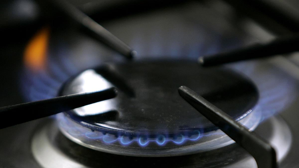 File photo of gas-lit flame burning on a natural gas stove. (AP Photo/Thomas Kienzle, File)