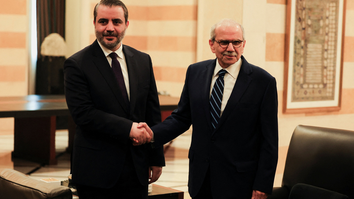 Lebanon's Prime Minister Nawaf Salam shakes hands with Syrian Foreign Minister Asaad Al-Shaibani at the Government Palace, in Beirut, Lebanon, July 2, 2026. REUTERS/Mohamed Azakir