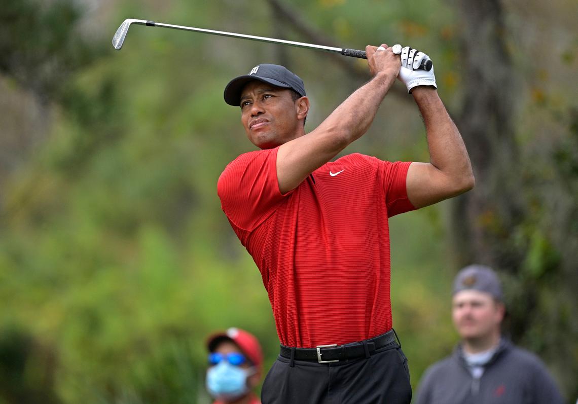 FILE - Tiger Woods watches his tee shot on the fourth hole during the final round of the PNC Championship golf tournament in Orlando, Fla., on Dec. 20, 2020. “Tiger,” a two part documentary about Woods premieres Jan. 10 on HBO.