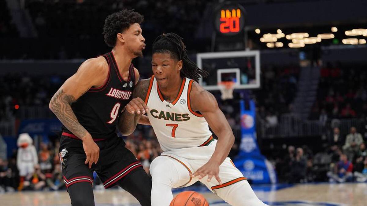  Mar 12, 2026; Charlotte, NC, USA; Miami (FL) Hurricanes forward Shelton Henderson (7) works the ball against Louisville Cardinals forward Khani Rooths (9) during the first half at Spectrum Center. Mandatory Credit: Jim Dedmon-Imagn Images | Jim Dedmon-Imagn Images 