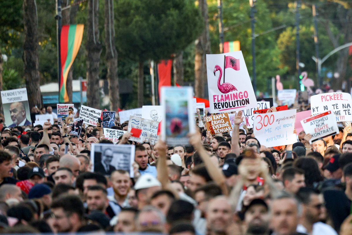 Protesters hold banners during a protest against a luxury resort development planned by a company linked with Donald Trump's son-in-law, Jared Kushner, on an environmentally sensitive part of the Adriatic coast, in Tirana, Albania, June 4, 2026. REUTERS/Florion Goga