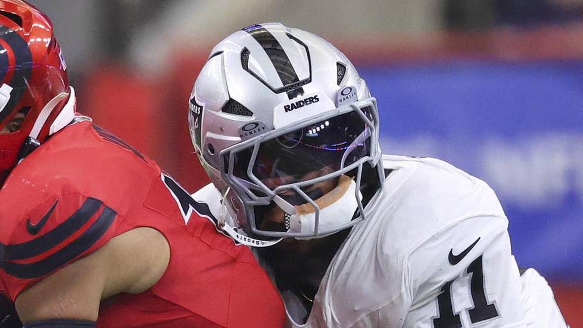  Dec 21, 2025; Houston, Texas, USA; Houston Texans wide receiver Christian Kirk (13) runs with the ball after a reception as Las Vegas Raiders safety Jeremy Chinn (11) attempts to make a tackle during the second quarter at NRG Stadium. Mandatory Credit: Troy Taormina-Imagn Images | Troy Taormina-Imagn Images 