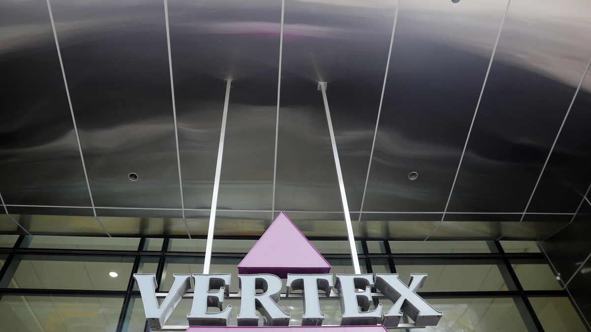 FILE PHOTO: A sign hangs in front of the world headquarters of Vertex Pharmaceuticals in Boston, Massachusetts, U.S., October 23, 2019. REUTERS/Brian Snyder/File Photo