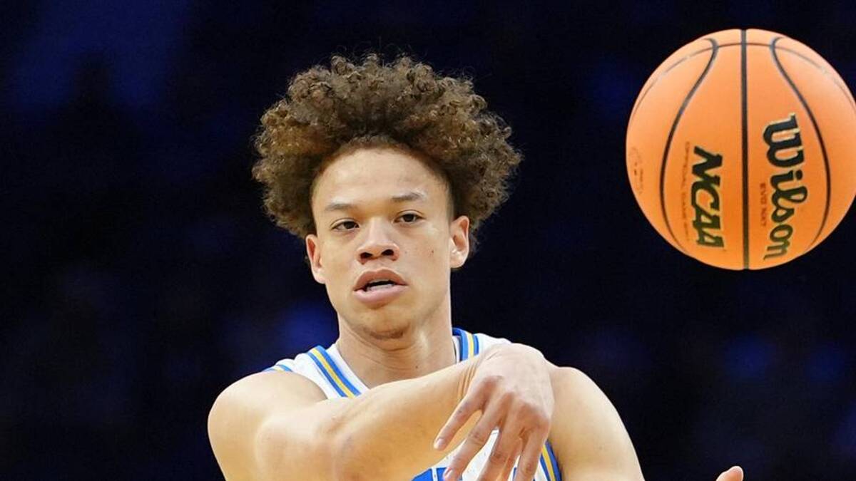  Mar 20, 2026; Philadelphia, PA, USA; UCLA Bruins guard Trent Perry (0) makes a pass against the UCF Knights in the first half during a first round game of the men's 2026 NCAA Tournament at Xfinity Mobile Arena. Mandatory Credit: Kyle Ross-Imagn Images | Kyle Ross-Imagn Images 