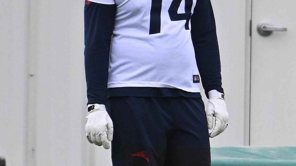  May 9, 2026; Foxborough, MA, USA; New England Patriots 2025-2026 tackle Caleb Lomu (74) talks to a member of the coaching staff and tackle Lorenz Metz (72) during the New England Patriots rookie camp at Gillette Stadium. Mandatory Credit: Eric Canha-Imagn Images | Eric Canha-Imagn Images 