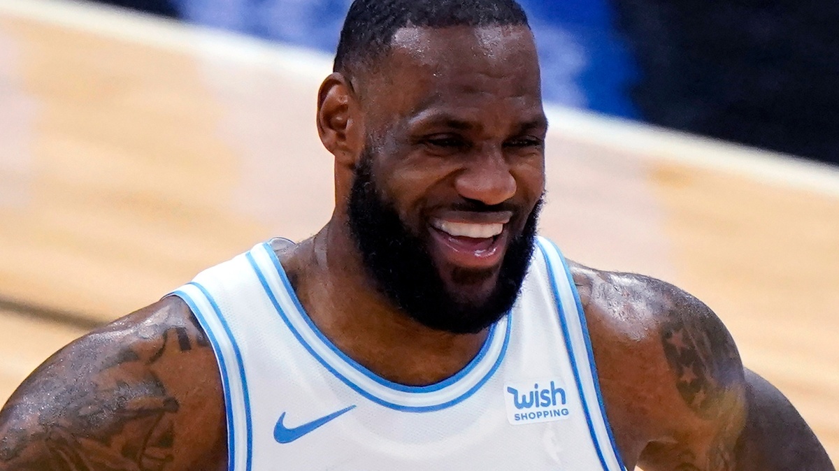 FILE - In this Jan. 23, 2021, file photo, Los Angeles Lakers forward LeBron James smiles during the second half of an NBA basketball game against the Chicago Bulls in Chicago.