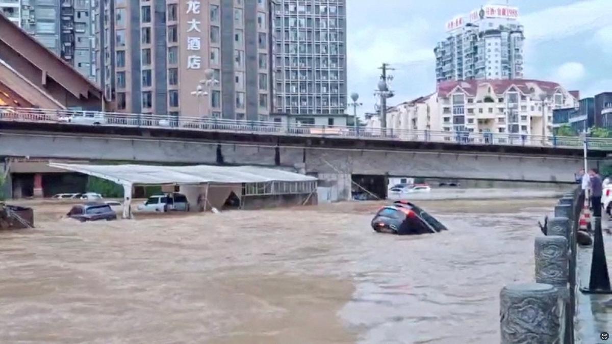 Cars partially submerged in floodwaters after heavy rainfall in Duyun, Guizhou Province, China, May 19, 2026, in this still image obtained from a social media video. Social Media/via REUTERS