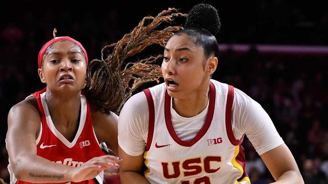  Feb 8, 2025; Los Angeles, California, USA; USC Trojans guard JuJu Watkins (12) drives to the basket as Ohio State Buckeyes guard Chance Gray (21) tries to defend during the fourth quarter at Galen Center. Mandatory Credit: Robert Hanashiro-Imagn Images | Robert Hanashiro-Imagn Images 