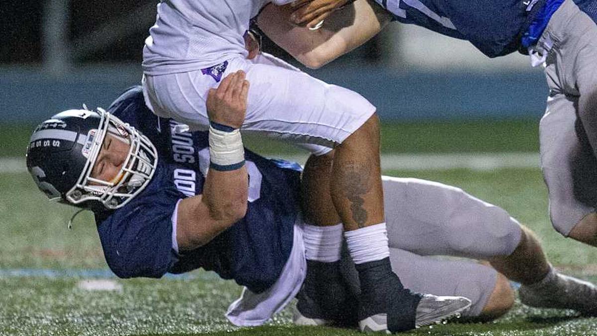 Cherry Hill West's Jordon DeJesus Gonzalez is sacked by Middletown South's Colin Gallagher and Luke Wafle during the first half of the Cherry Hill West vs. Middletown South NJSIAA Central Group 4 playoff football game at Middletown High School South in Middletown, NJ Friday, October 28, 2022. | Tanya Breen / USA TODAY NETWORK 