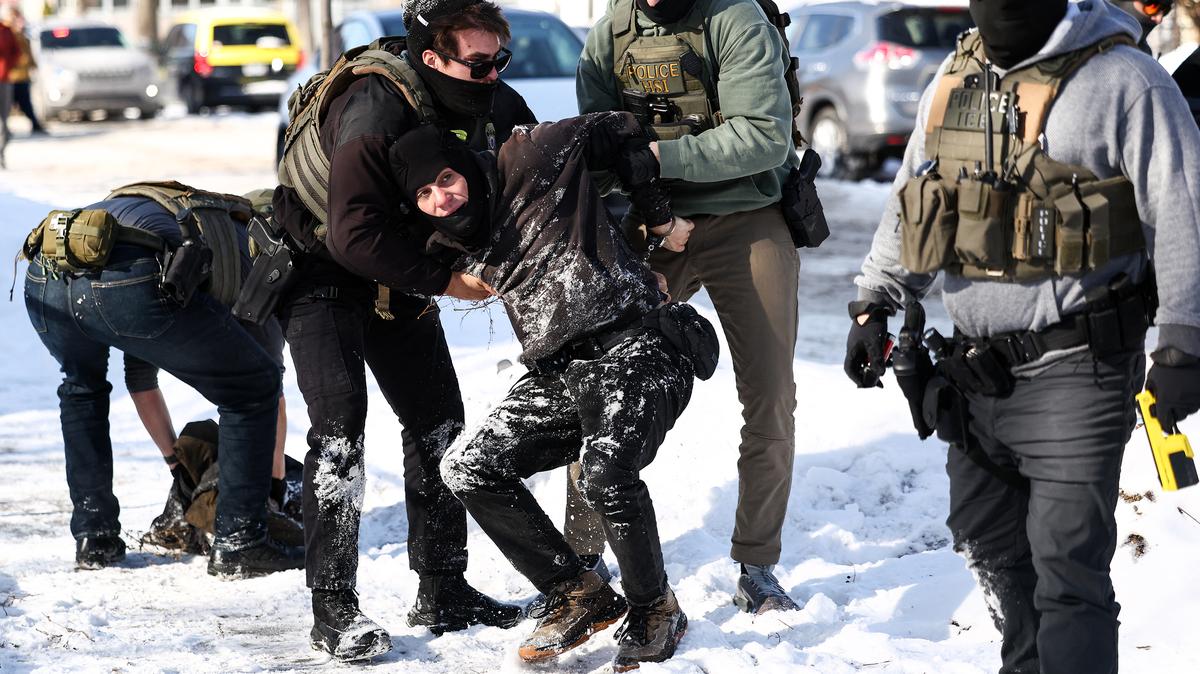 Federal agents detain a protester in Minneapolis on Feb. 3, 2026. (Charly Triballeau/AFP/Getty Images/TNS)