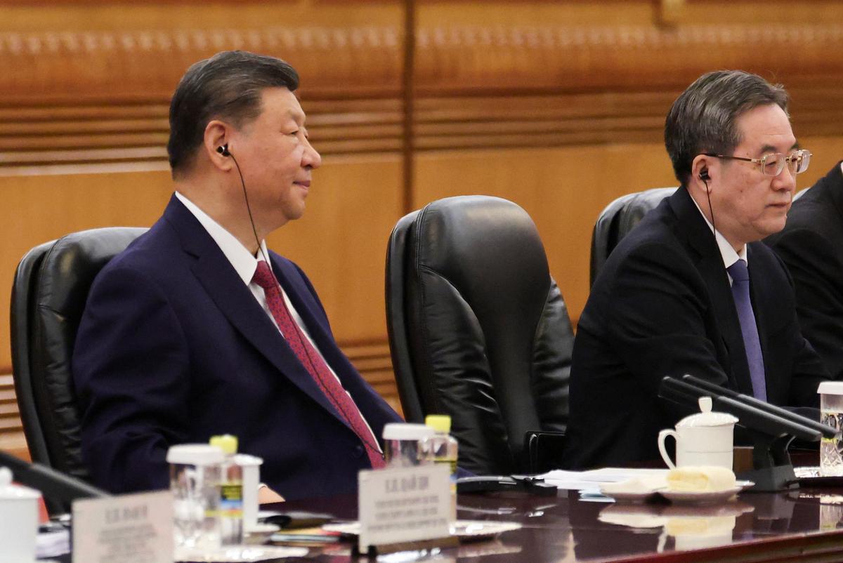 Chinese President Xi Jinping, alongside Chinese Vice Premier Ding Xuexiang, attends a bilateral meeting with Russian President Vladimir Putin (not pictured) at the Great Hall of the People in Beijing, China May 20, 2026. REUTERS/Maxim Shemetov/Pool