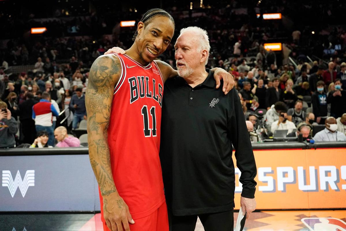 Former Chicago Bulls guard DeMar DeRozan hugs former San Antonio Spurs head coach Gregg Popovich Scott Wachter-Imagn Images