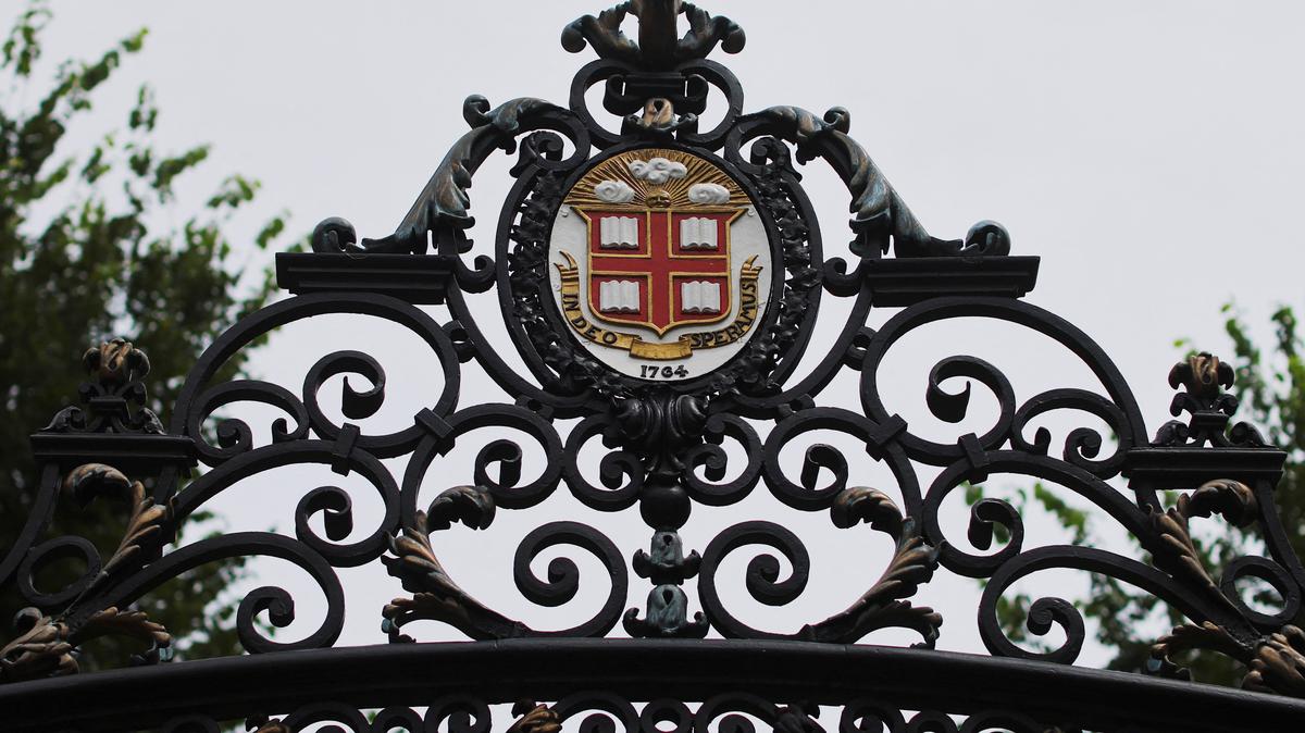 The seal of Brown University sits atop the Van Wickle Gates at the edge of the main campus in Providence, Rhode Island, U.S., August 16, 2022. REUTERS/Brian Snyder