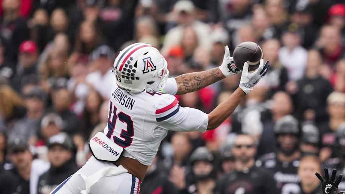  Nov 15, 2025; Cincinnati, Ohio, USA; Arizona Wildcats defensive back Dalton Johnson (43) intercepts a pass intended for Cincinnati Bearcats wide receiver Cyrus Allen (4) in the first half at Nippert Stadium. Mandatory Credit: Aaron Doster-Imagn Images | Aaron Doster-Imagn Images 