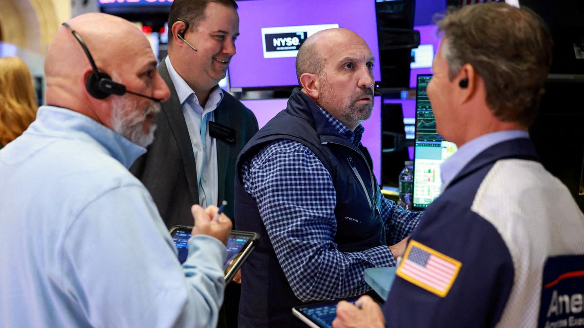 FILE PHOTO: Traders work on the floor at the New York Stock Exchange (NYSE) in New York City, U.S., May 5, 2026.  REUTERS/Brendan McDermid/File Photo