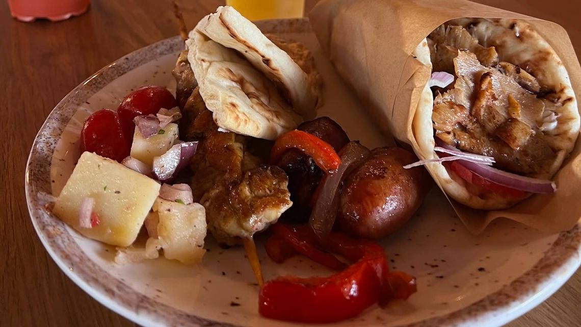  Royal Beach Club Santorini offers an all-you-can-eat Greek food buffet. 