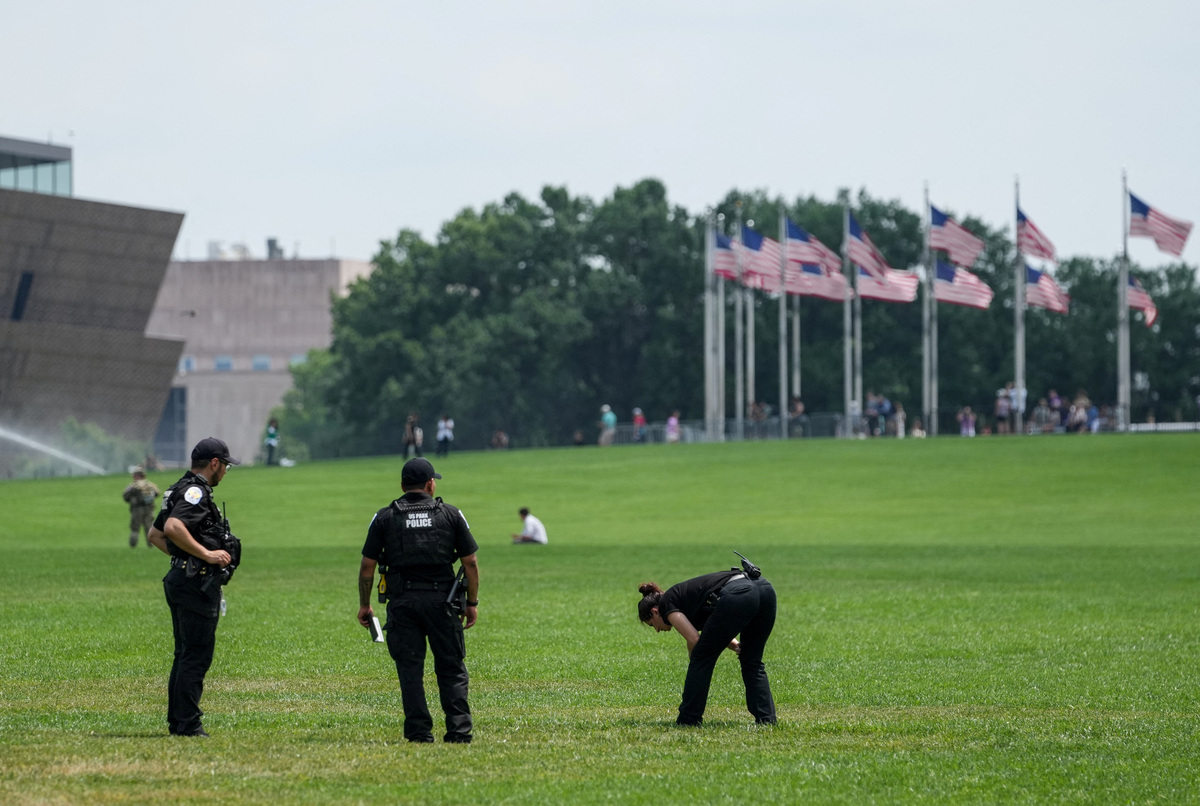 Authorities responded to what appeared to be a large tracing of the term 8647 into the grounds of the National Mall in Washington, D.C., June 11, 2026. A Reuters photographer captured the emerging image from atop the Washington Monument on the Mall's grass shortly before authorities arrived. The arrangement of the numbers was clearly an attempt to show 8647, though the 4 was not fully formed. Federal prosecutors on other occasions have said the term could indicate a threat to President Trump, the 47th U.S. president. REUTERS/ Nathan Howard