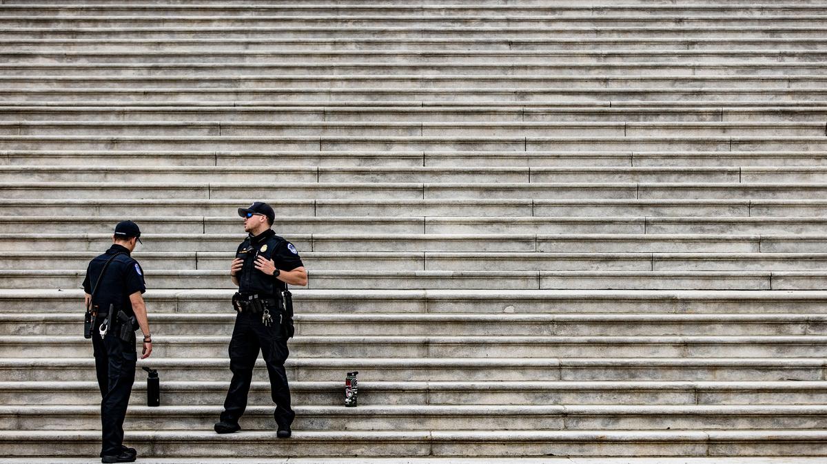 Capitol Police officers stand at the bottom of the steps to the Rotunda at the U.S. Capitol building on Capitol Hill in Washington, D.C. on April 29, 2021. (Samuel Corum/AFP/Getty Images/TNS)