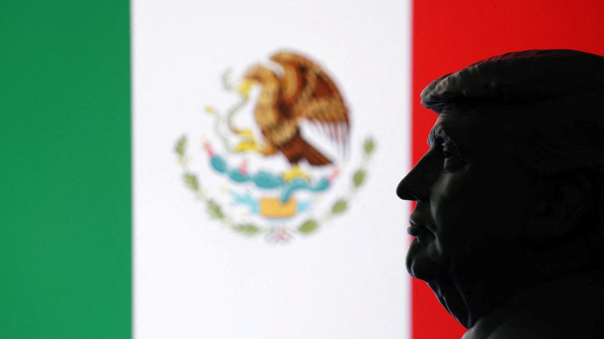 A 3D-printed miniature model of U.S. President Donald Trump and the Mexican flag are seen in this photo illustration taken July 23, 2025. The U.S. Department of State has started a review of the more than 50 Mexican consulates operating in the United States, an agency official said on Thursday.