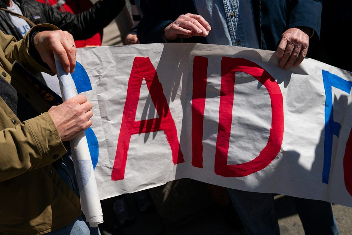  Former USAID staff and supporters rally in protest of the agency's dismantlement. AP Photo/Allison Robbert 