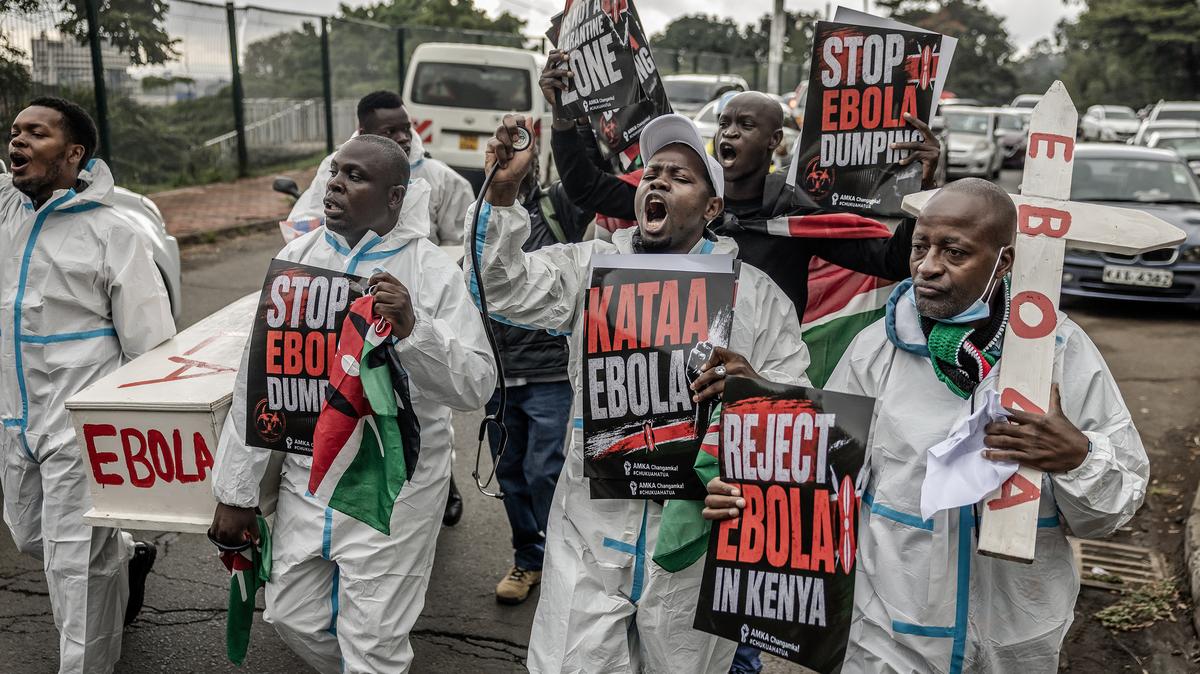 Activists chant slogans as they carry placards and a mock coffin during a protest against a US-built Ebola quarantine center planned to begin operations at Kenya's Laikipia Air Base, in Nairobi on June 2, 2026. Kenya's president defended the opening of an Ebola quarantine center for U.S. nationals after a court halted the plan and security forces teargassed protesters fearing the deadly virus could spread in the country. (Luis Tato/AFP/Getty Images/TNS)
