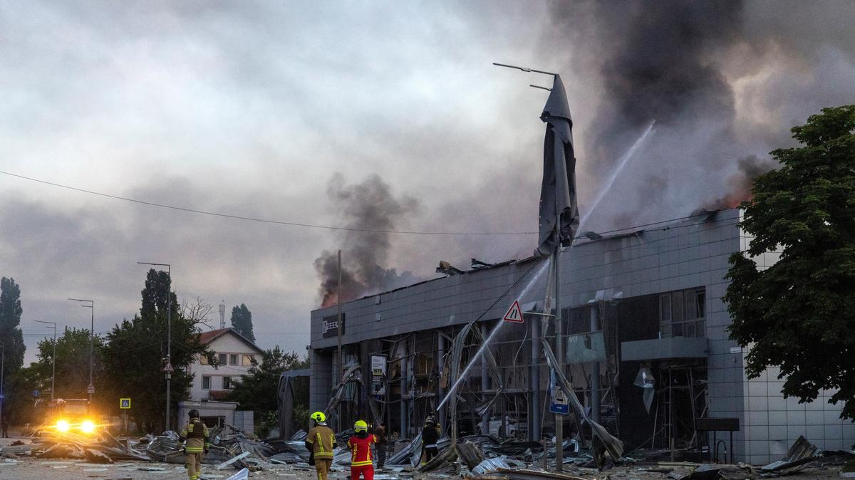 Emergency workers respond to a fire in a car dealership that was struck during overnight Russian missile and drone attacks, amid Russia's attack on Ukraine, in Kyiv, Ukraine, June 2, 2026. REUTERS/Thomas Peter