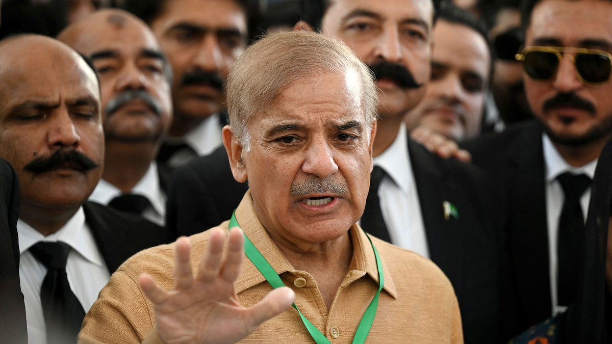 Pakistan's then opposition leader Shehbaz Sharif, center, speaks with the media before attending a hearing outside the Supreme Court building in Islamabad on April 7, 2022. Sharif, now prime minister, and military chief Asim Munir are heading to Switzerland to take part in U.S.-Iran talks, the government announced Saturday, June 20, 2026, bringing one of the key mediators between the two adversaries to the table.(Aamir Qureshi/AFP/Getty Images/TNS)