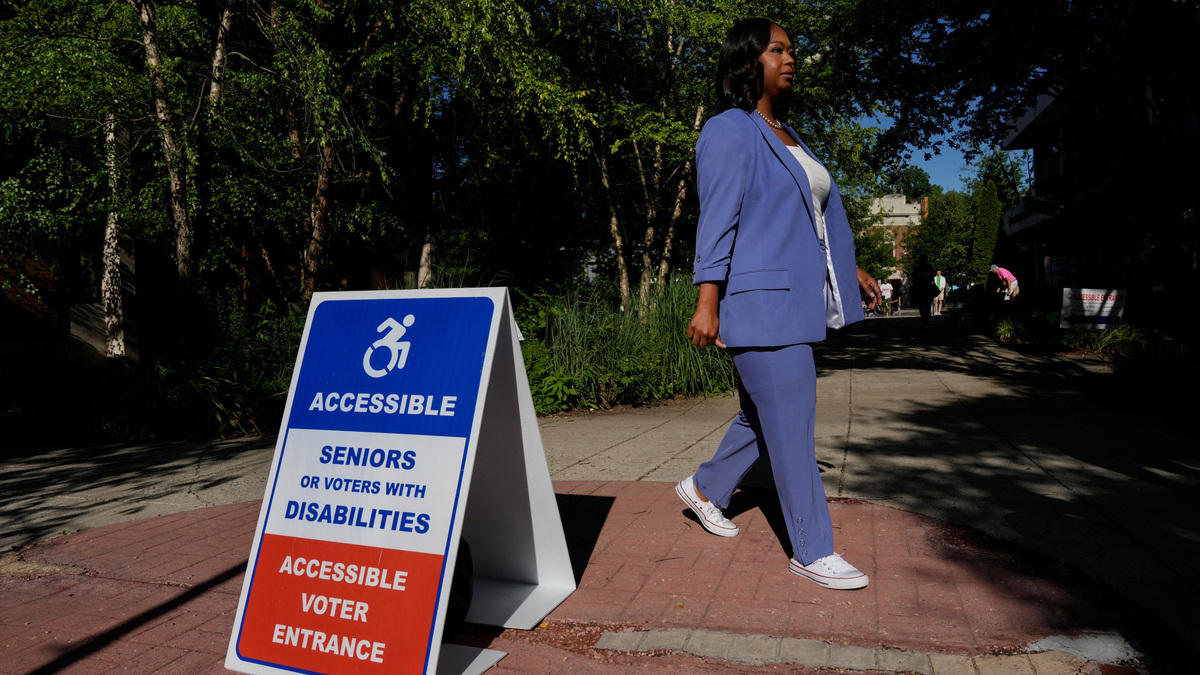 DC Mayoral candidate Janeese Lewis George takes photos with her staff while greeting people near a voting site at the Chevy Chase Community Center during DC’s primary voting day in Washington, D.C., U.S., June 16, 2026. REUTERS/Leah Millis