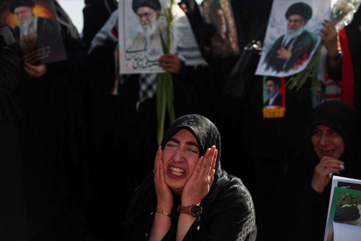 A woman reacts as mourners gather on the day of a public farewell ceremony to pay their respects to late Supreme Leader Khamenei, who was killed on February 28 in Israeli and U.S. airstrikes, at the Imam Khomeini Grand Mosalla, in Tehran, Iran July 4, 2026.  Majid Asgaripour/WANA (West Asia News Agency) via REUTERS