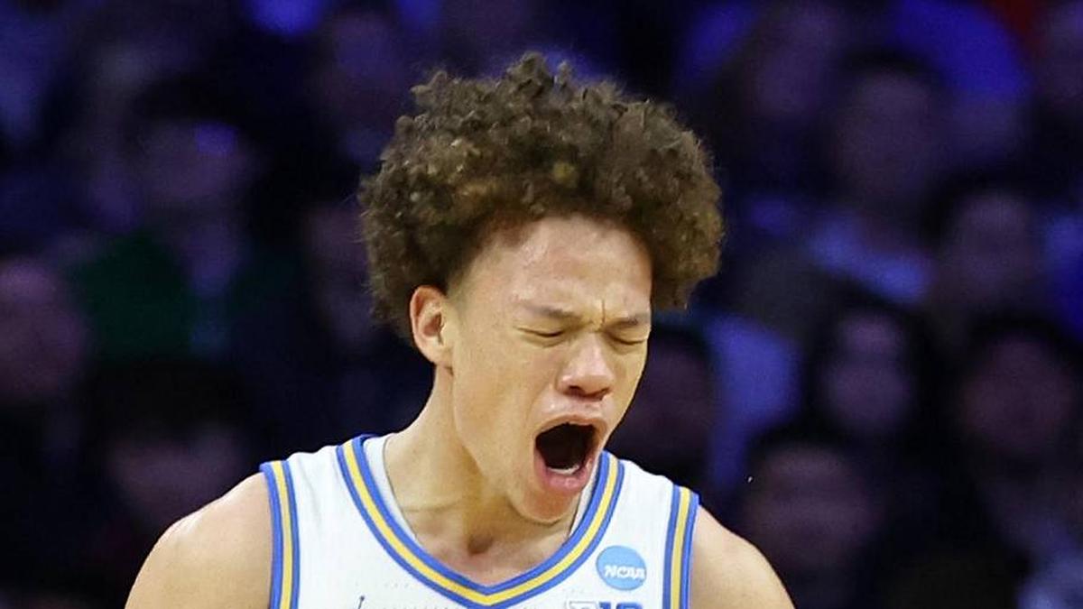  Mar 20, 2026; Philadelphia, PA, USA; UCLA Bruins guard Trent Perry (0) reacts with guard Eric Freeny (8) in the second half during a first round game of the men's 2026 NCAA Tournament at Xfinity Mobile Arena. Mandatory Credit: Bill Streicher-Imagn Images | Bill Streicher-Imagn Images 