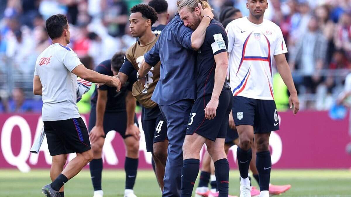 U.S. Men’s National Team coach Mauricio Pochettino, center left, embraces Tim Ream after the team's 4-1 loss to Belgium in the World Cup Round of 16 on Monday in Seattle, Wash.
