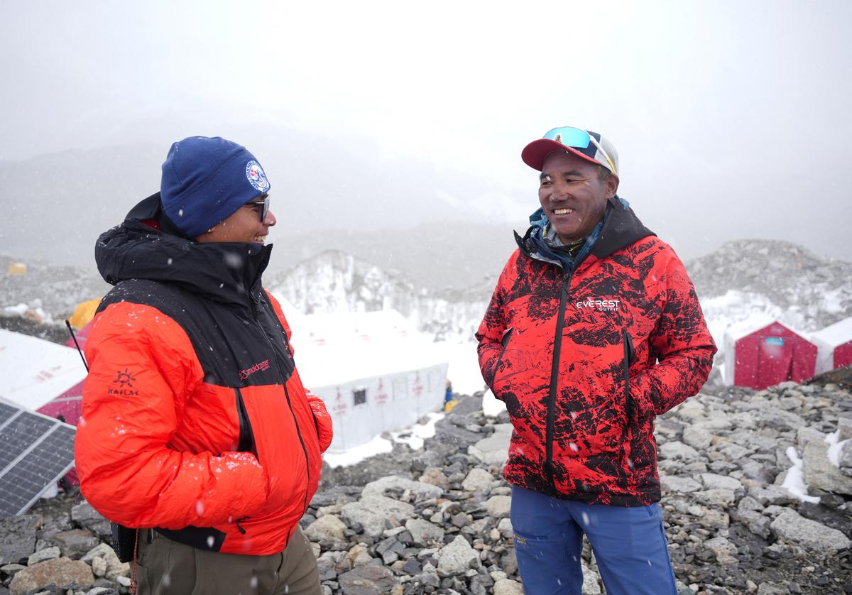 Kami Rita Sherpa, 55, a Nepali mountaineer who has climbed Mount Everest 31 times and holds the record for the most summits of the world's highest mountain, smiles as he speaks with a friend at Everest Base Camp as he prepares to climb Everest for the 32nd time to break his own record, in the Solukhumbu district, also known as the Everest region, Nepal, April 29, 2026. REUTERS/Purnima Shrestha