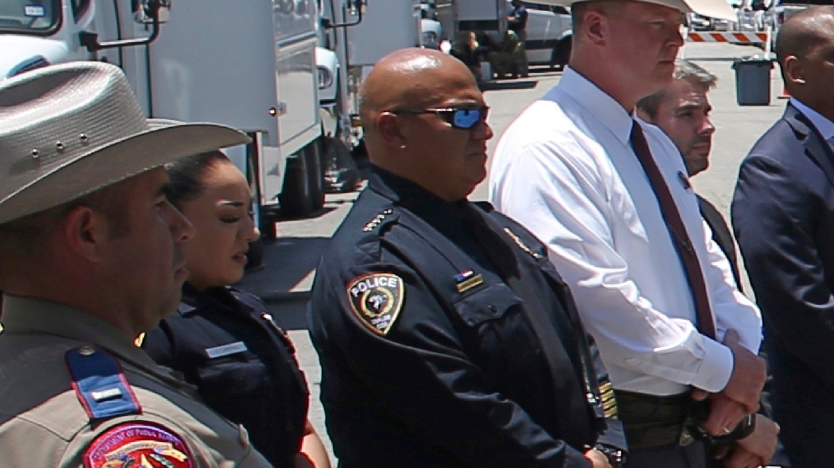 In this May 26 file photo, Uvalde School Police Chief Pete Arredondo, third from left, stands during a news conference outside of Robb Elementary School in Uvalde. The Uvalde school board on Wednesday voted unanimously to fire Arredondo after law enforcement’s bumbling response to the mass shooting at the school on May 24.