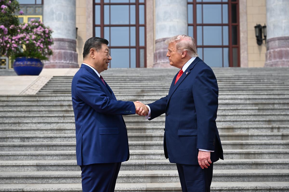 President Xi Jinping of China greets President Donald Trump outside the Great Hall of the People in Beijing during their two-day summit, on Thursday, May 14, 2026. During the first U.S. presidential visit to China in nearly a decade, Xi delivered a warning on Taiwan, saying that the issue, if handled poorly, could lead to conflict and "an extremely dangerous situation." (Kenny Holston/The New York Times)..