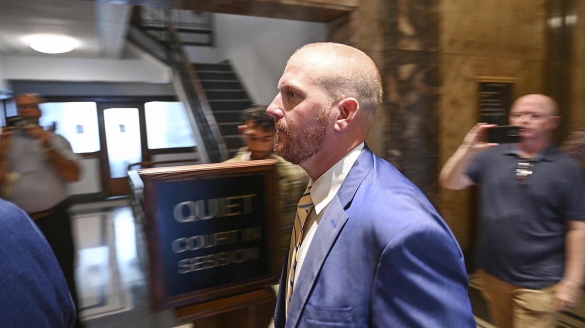 Former Kansas City Chiefs assistant coach Britt Reid walks to a courtroom at the Jackson County Courthouse on Sept. 12, 2022.