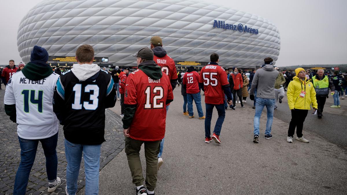 Fans arrive for a NFL match between Tampa Bay Buccaneers and Seattle Seahawks at the Allianz Arena in Munich, Germany, Sunday, Nov. 13, 2022. (AP Photo/Markus Schreiber)