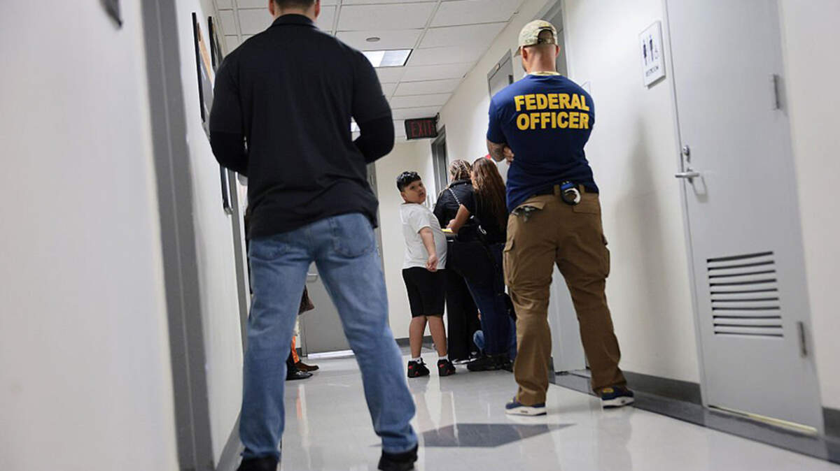 Immigration and Customs Enforcement agents patrol the halls of immigration court at the Jacob K. Javits Federal Building in New York on June 24. Federal immigration officials have detained more than 10,000 people in the last five days, a major surge that has stemmed from a push within ICE to increase arrest rates.