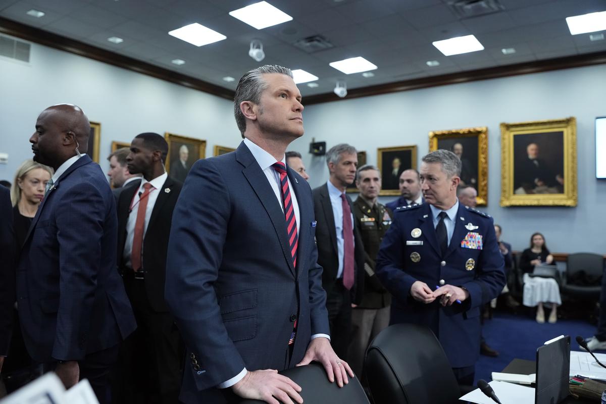Defense Secretary Pete Hegseth, center, and Gen. Dan Caine, the chairman of the Joint Chiefs of Staff, right, arrive to testify before the House and Senate appropriations subcommittees on defense in Washington on Tuesday, May 12, 2026. (Haiyun Jiang/The New York Times)