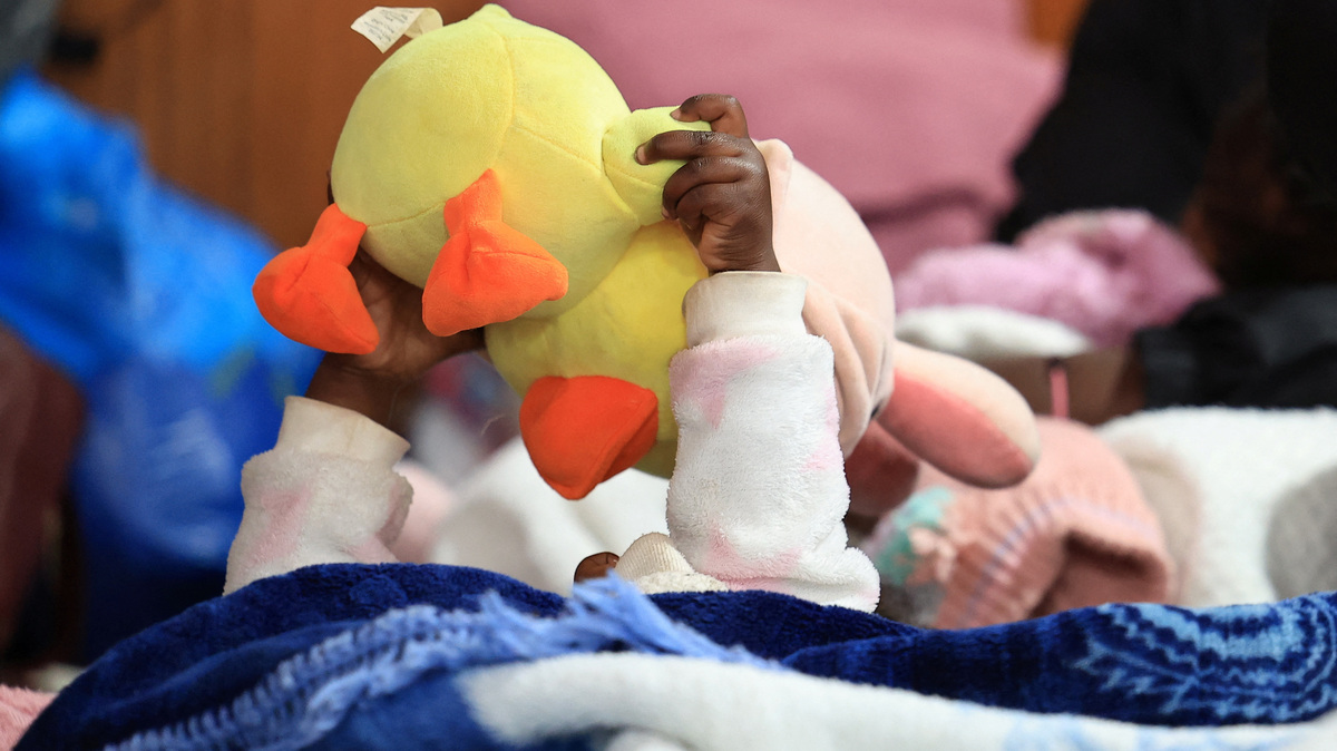 A migrant child plays with her toy while sheltering in a hall with her family, following an escalation in anti-immigrant protests which heightened fears among foreign communities, in Kleinmond, South Africa, June 3, 2026. REUTERS/Esa Alexander