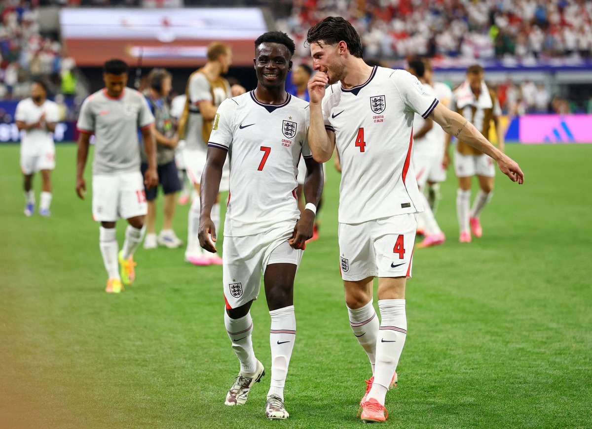  England's Declan Rice and Bukayo Saka celebrate after the match. 
