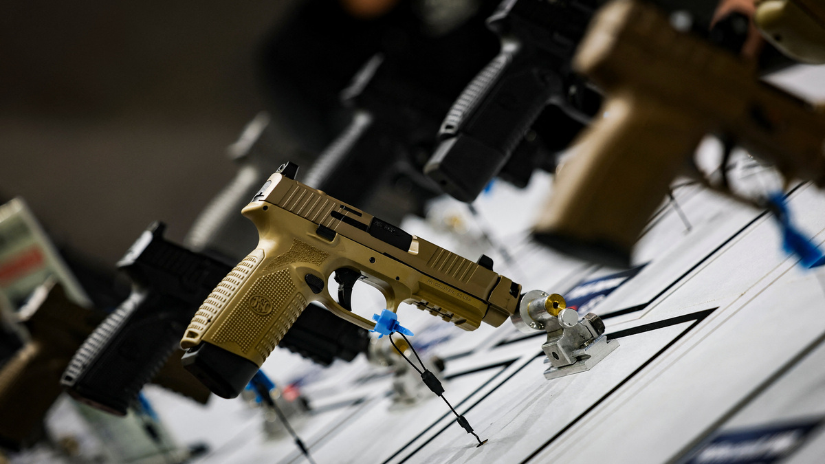 Pistols are displayed during the National Rifle Association annual meeting in Atlanta on April 25, 2025. The Supreme Court on Thursday sided with a marijuana user who challenged a ban on drug users owning firearms.