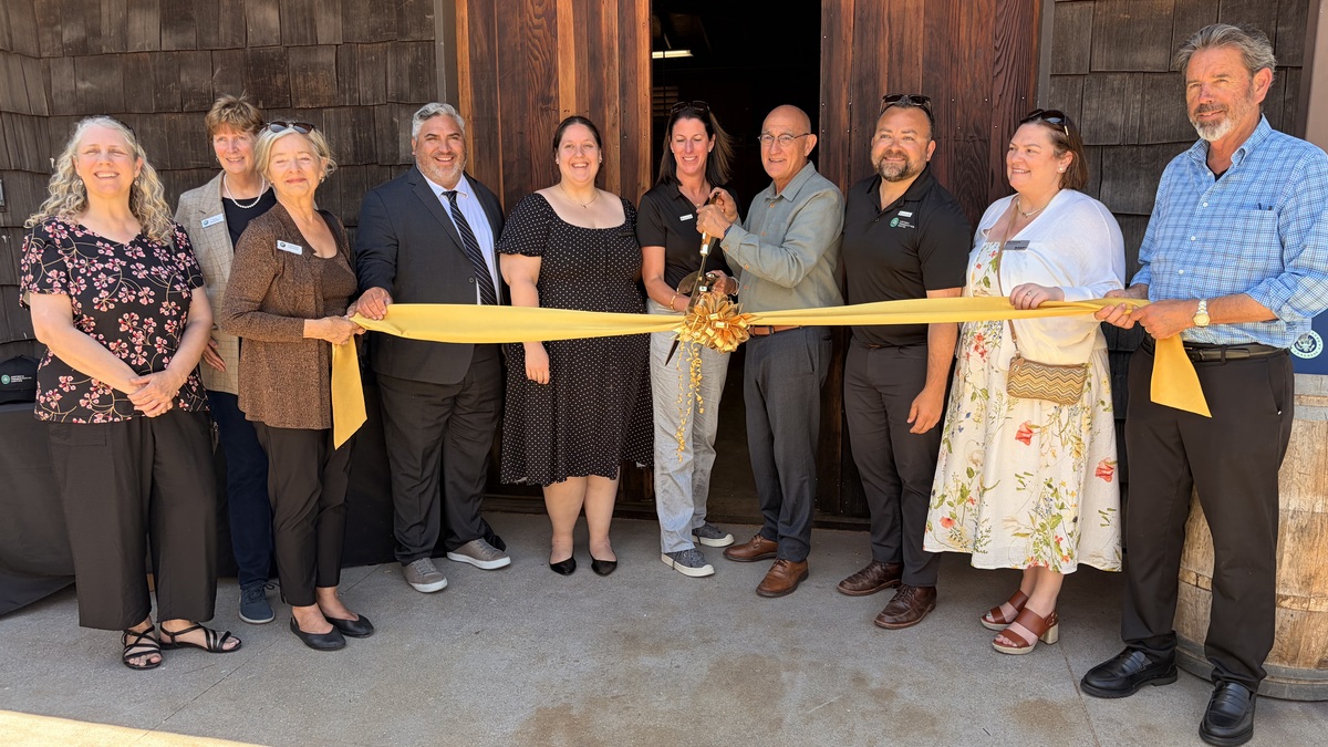 Pacific Grove council members, city officials, State Parks representatives and Asilomar workers stand together to signify the opening of the Historic Preservation Center. Asilomar Hotel and Conference Grounds will work to preserve the original structure of the building, while creating new educational opportunities for the public. (Photo by Kyarra Harris/Monterey Herald)