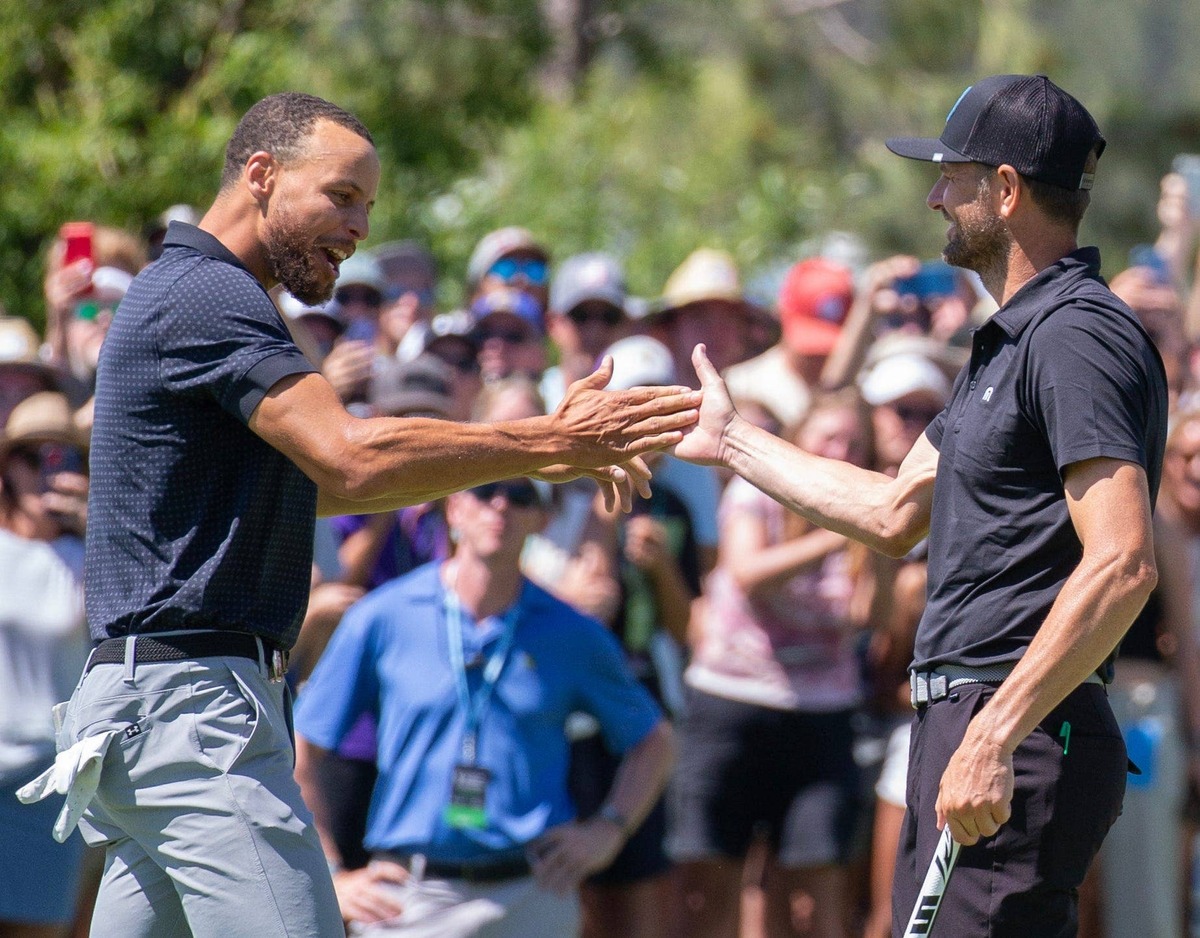  Stephen Curry shakes hands with Mardy Fish after sinking the winning putt during the final round of the 2023 American Century Celebrity Championship golf tournament at Edgewood Tahoe Golf Course in Stateline, Nev. (USA TODAY Network)