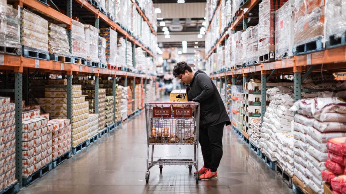  A shopper in an aisle at Costco. 